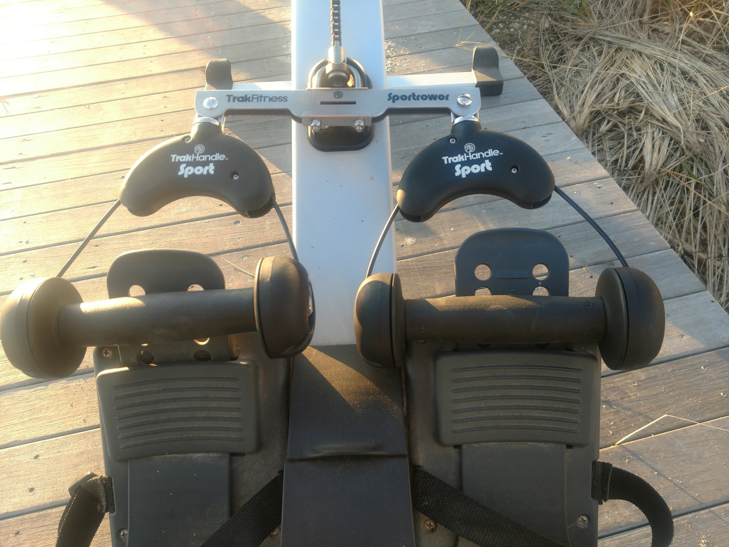 Rotating indoor rowing machine handles — TrakHandle multi-axis grip scene